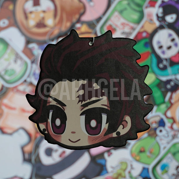 A custom-shaped air freshener designed to resemble an anime character with a watermelon scent.